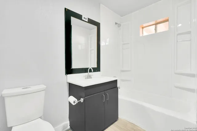 a bathroom with a toilet a sink and a bathtub