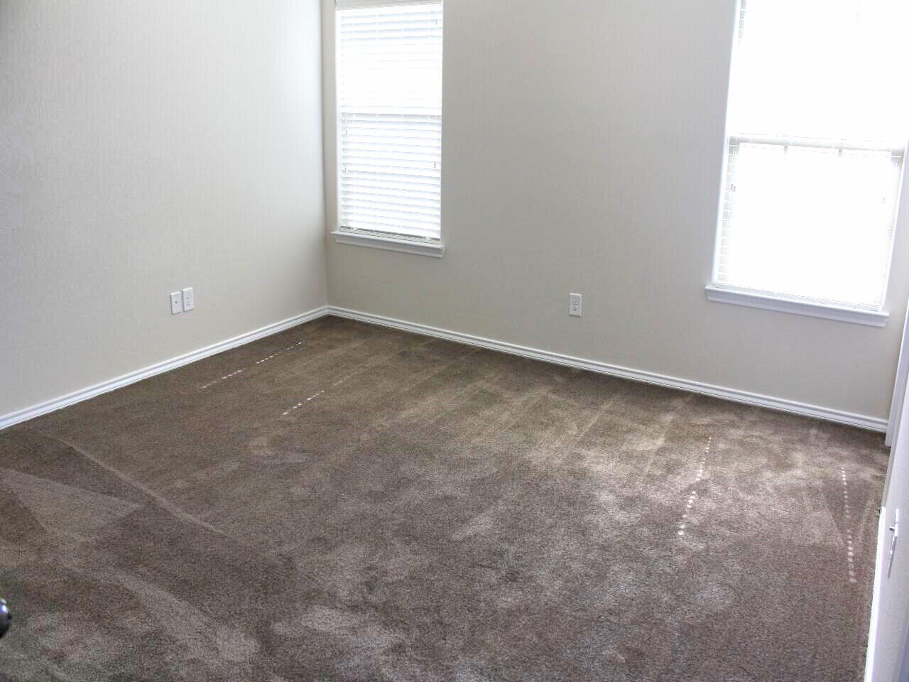 9802 Sherman Avenue Lubbock, TX 79423 - Photo 8 of 9 an empty room with a window