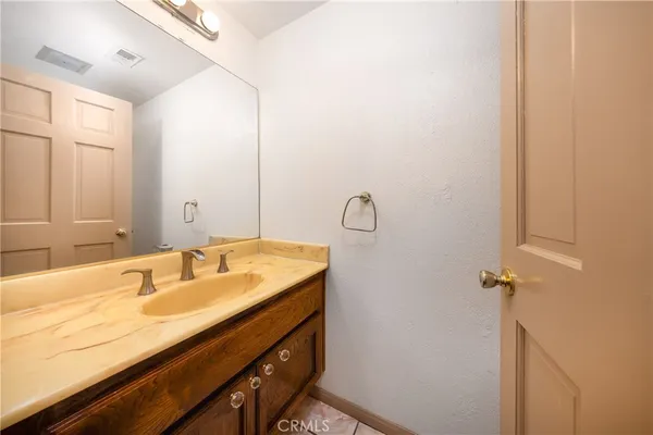 a kitchen with stainless steel appliances a stove a sink and a refrigerator