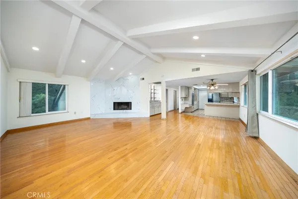 a spacious bathroom with a tub sink and mirror