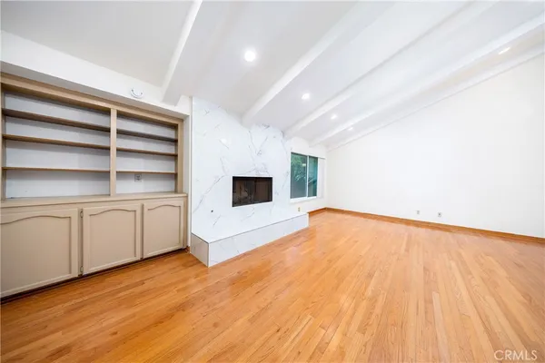 a view of a balcony with wooden fence
