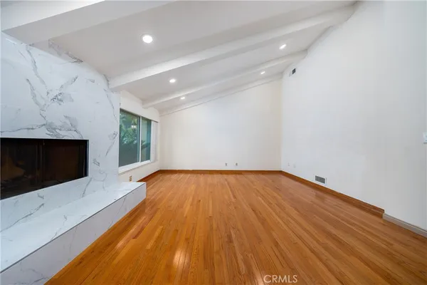 an aerial view of a house with a garden and swimming pool