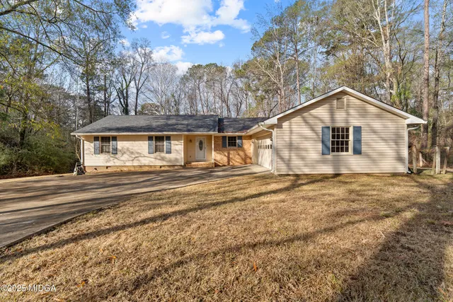 a house with trees in the background