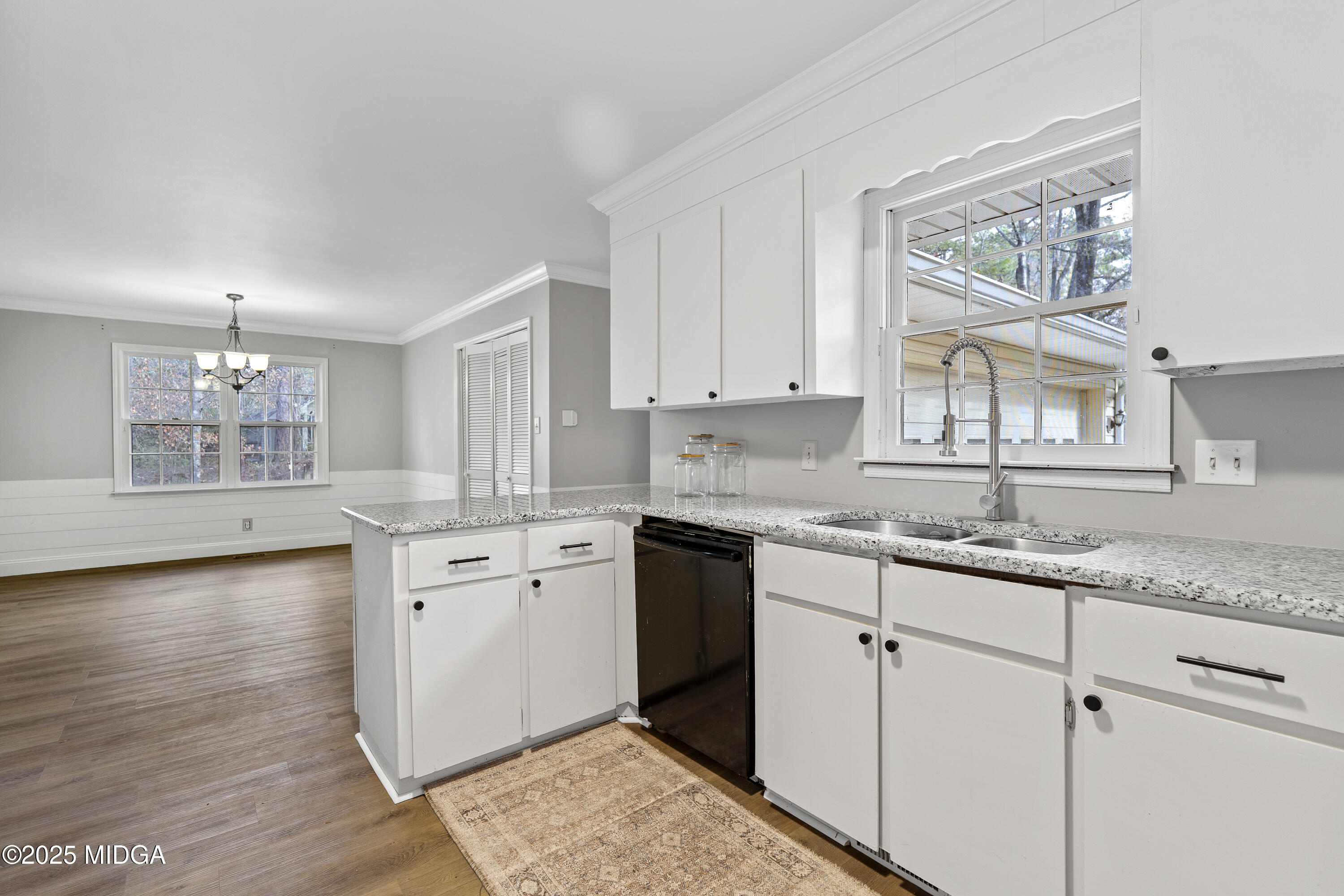 218 Matlock Lane Macon, GA 31210 - Photo 11 of 39 a kitchen with granite countertop a sink cabinets window and stainless steel appliances