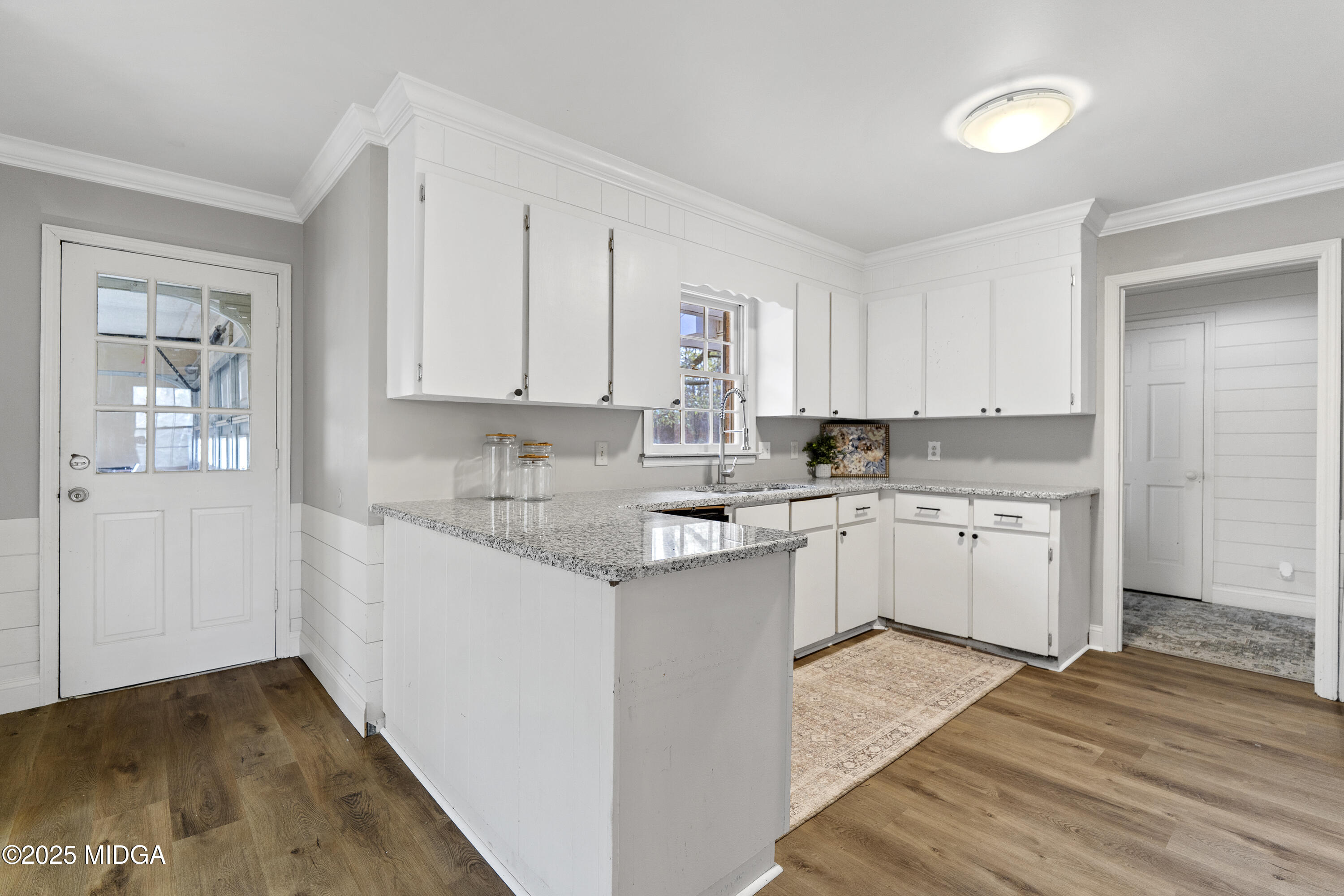 218 Matlock Lane Macon, GA 31210 - Photo 13 of 39 a kitchen with granite countertop white cabinets and white appliances