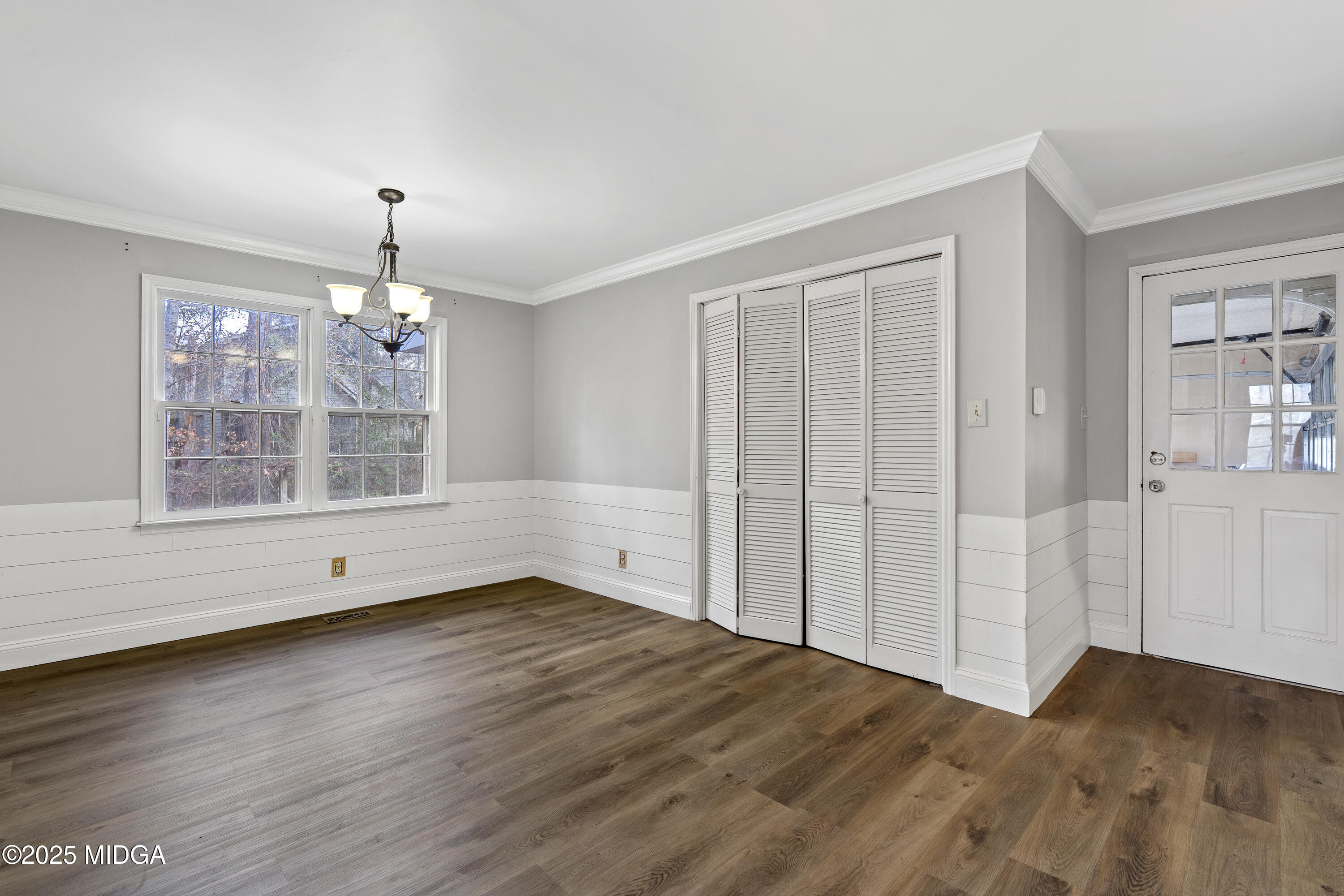 218 Matlock Lane Macon, GA 31210 - Photo 15 of 39 an empty room with wooden floor and windows