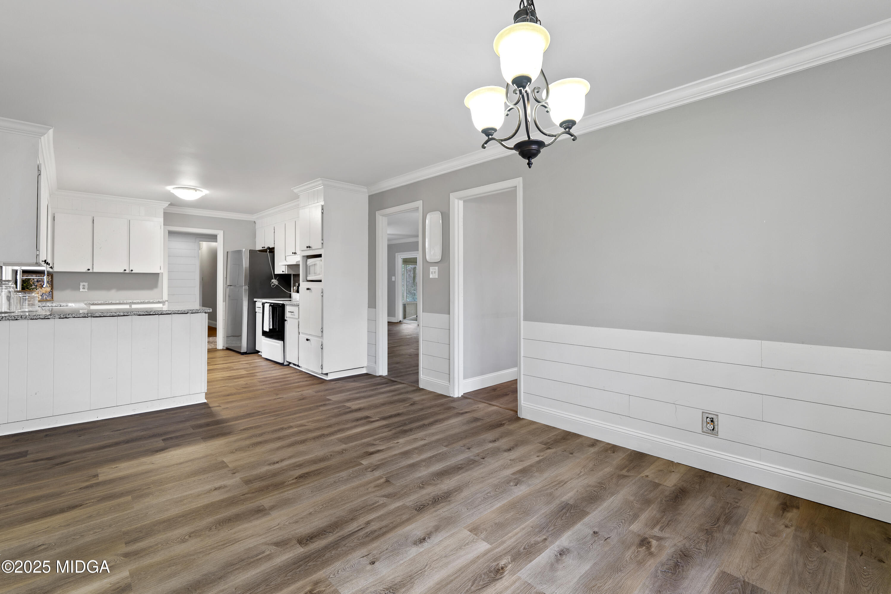 218 Matlock Lane Macon, GA 31210 - Photo 16 of 39 a view of a kitchen with wooden floor and a large window