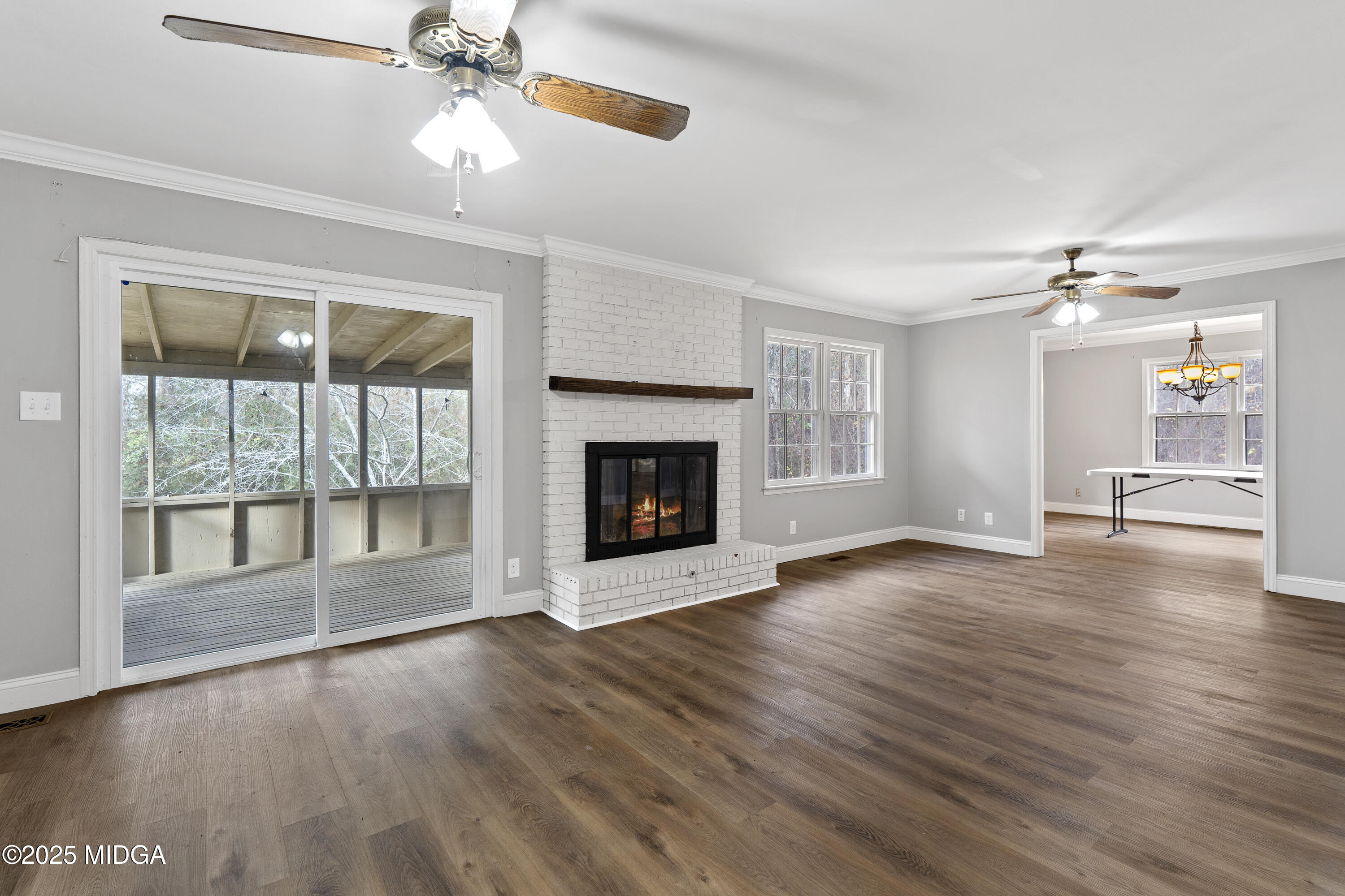218 Matlock Lane Macon, GA 31210 - Photo 20 of 39 a view of an empty room with wooden floor and a window