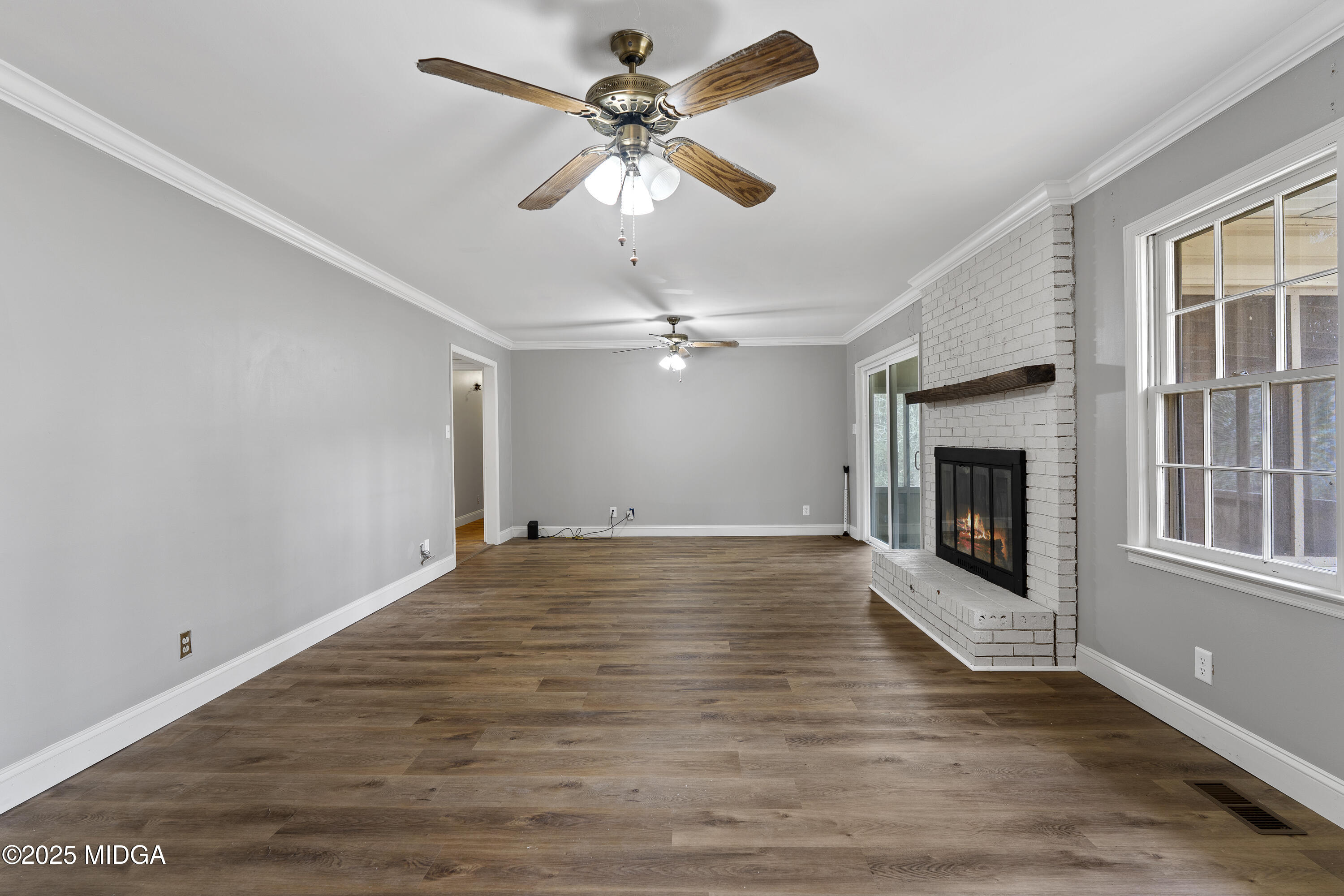 218 Matlock Lane Macon, GA 31210 - Photo 24 of 39 wooden floor in an empty room with a window