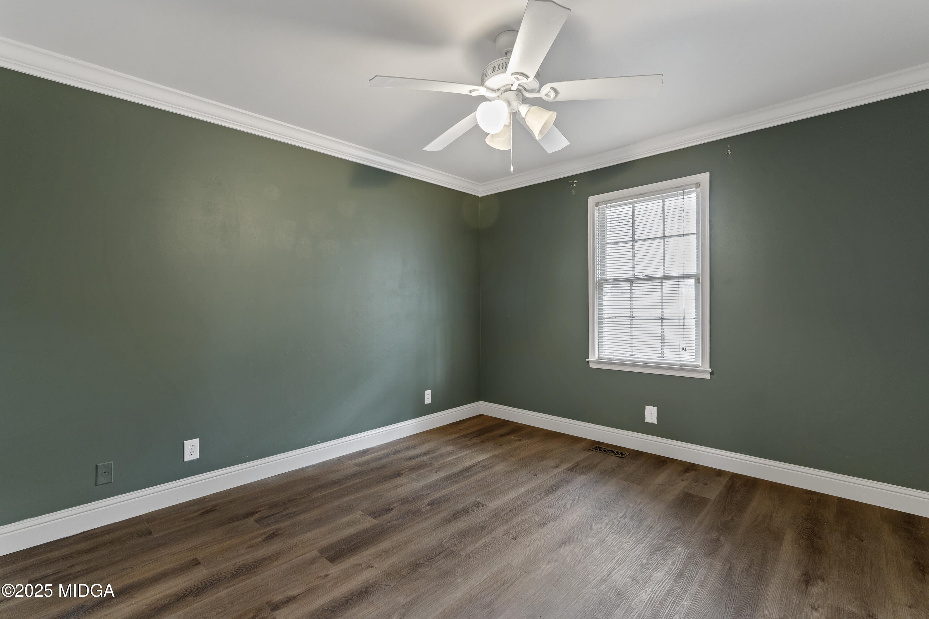 218 Matlock Lane Macon, GA 31210 - Photo 26 of 39 an empty room with wooden floor and windows