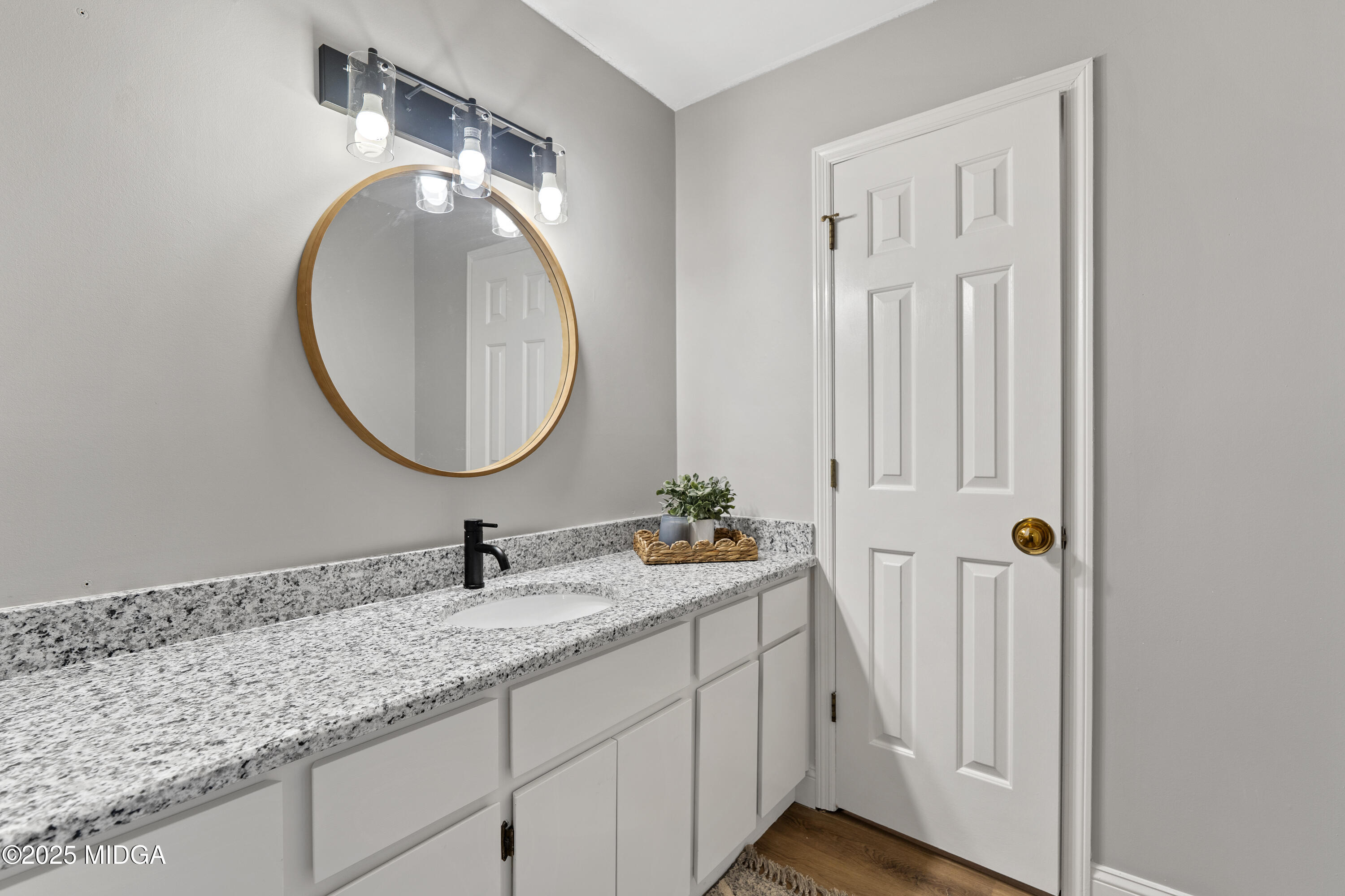 218 Matlock Lane Macon, GA 31210 - Photo 29 of 39 a bathroom with a double vanity sink and a mirror