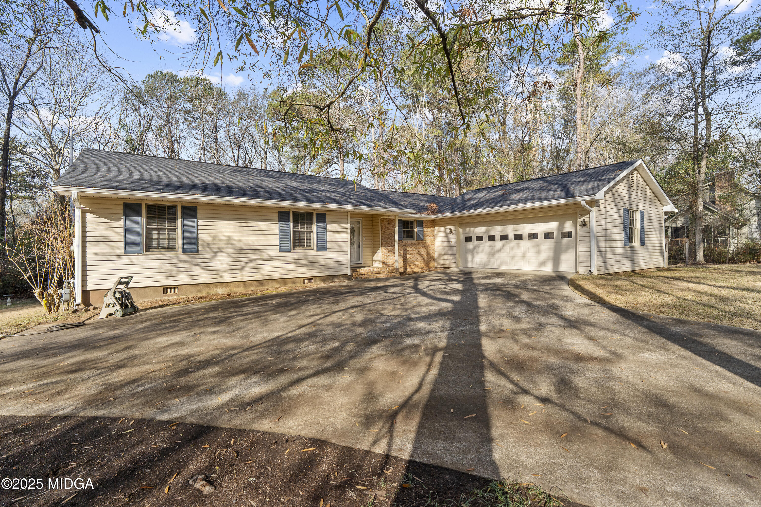 218 Matlock Lane Macon, GA 31210 - Photo 3 of 39 a front view of a house with a yard