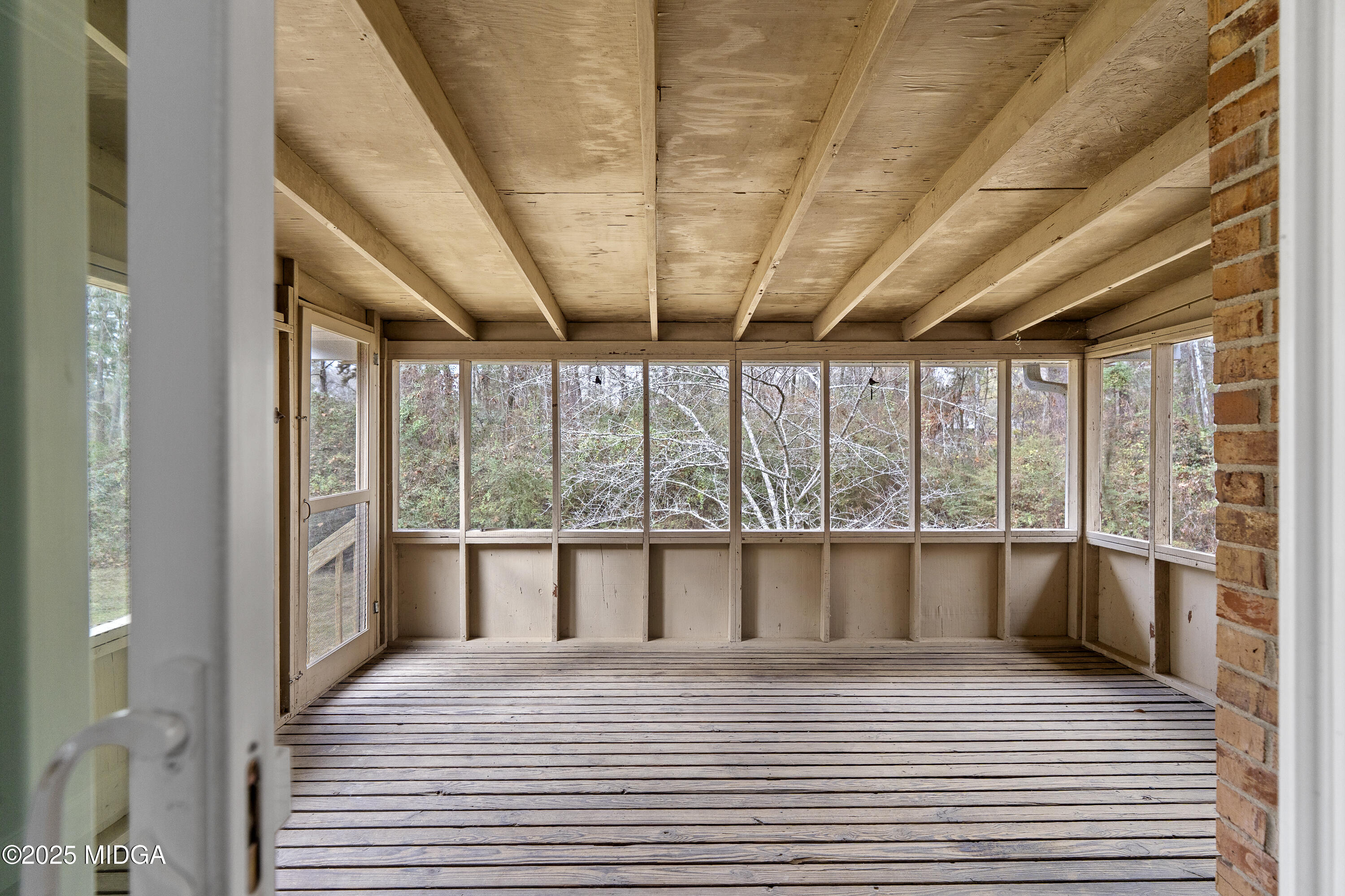 218 Matlock Lane Macon, GA 31210 - Photo 33 of 39 a view of empty room with wooden floor and city view
