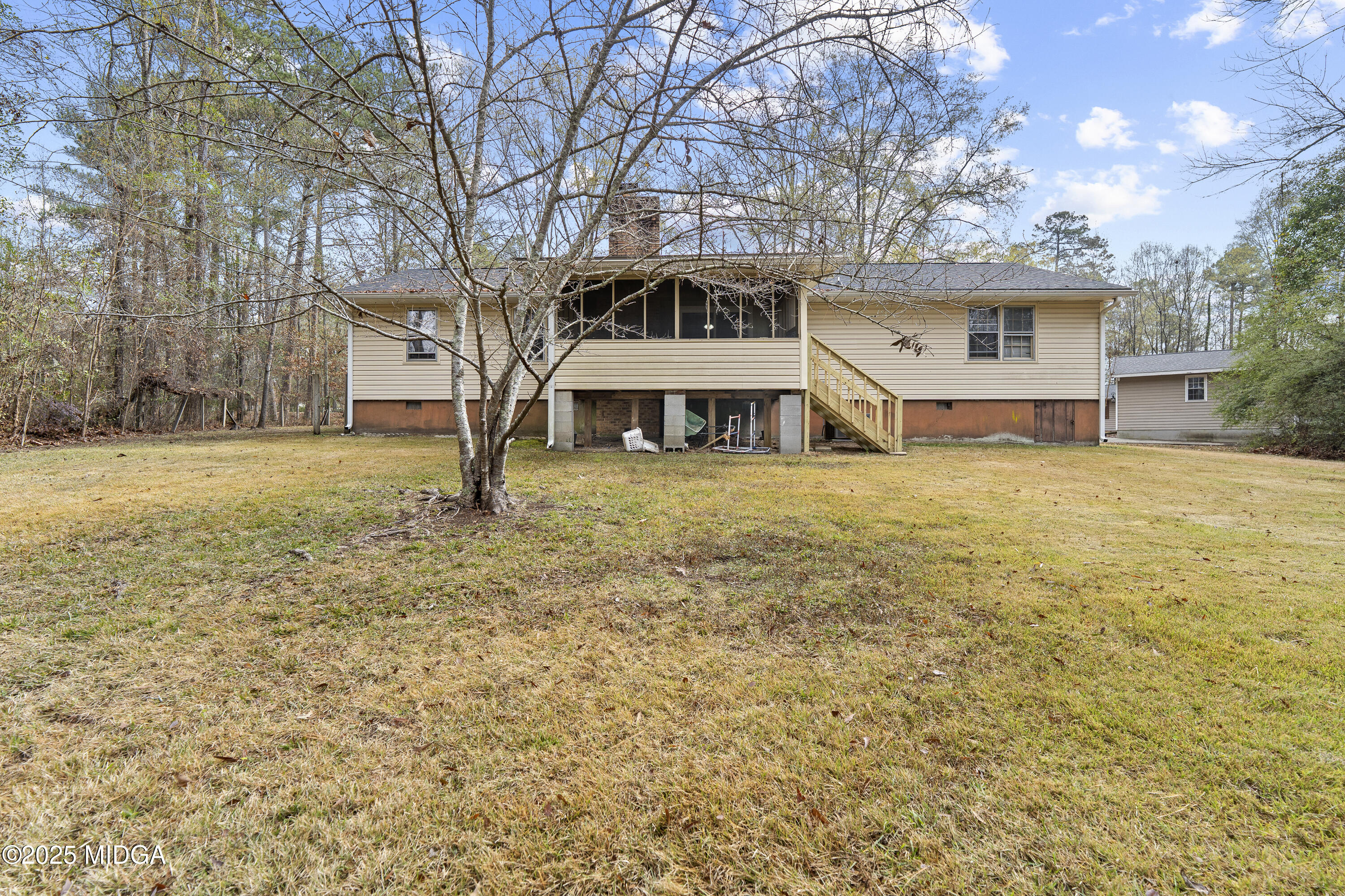 218 Matlock Lane Macon, GA 31210 - Photo 36 of 39 a view of a house with a yard and garage