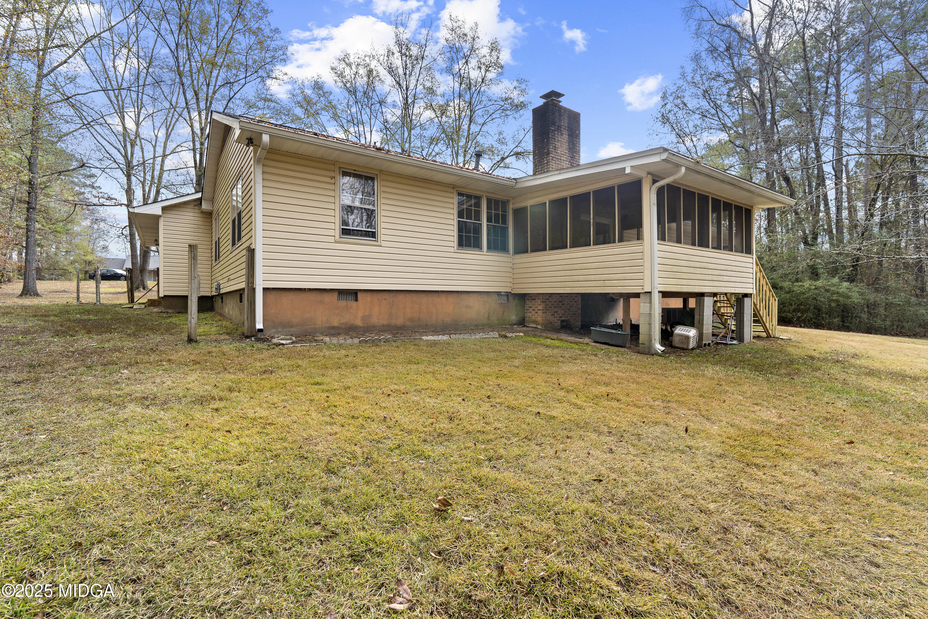 218 Matlock Lane Macon, GA 31210 - Photo 37 of 39 a front view of a house with a yard covered in snow