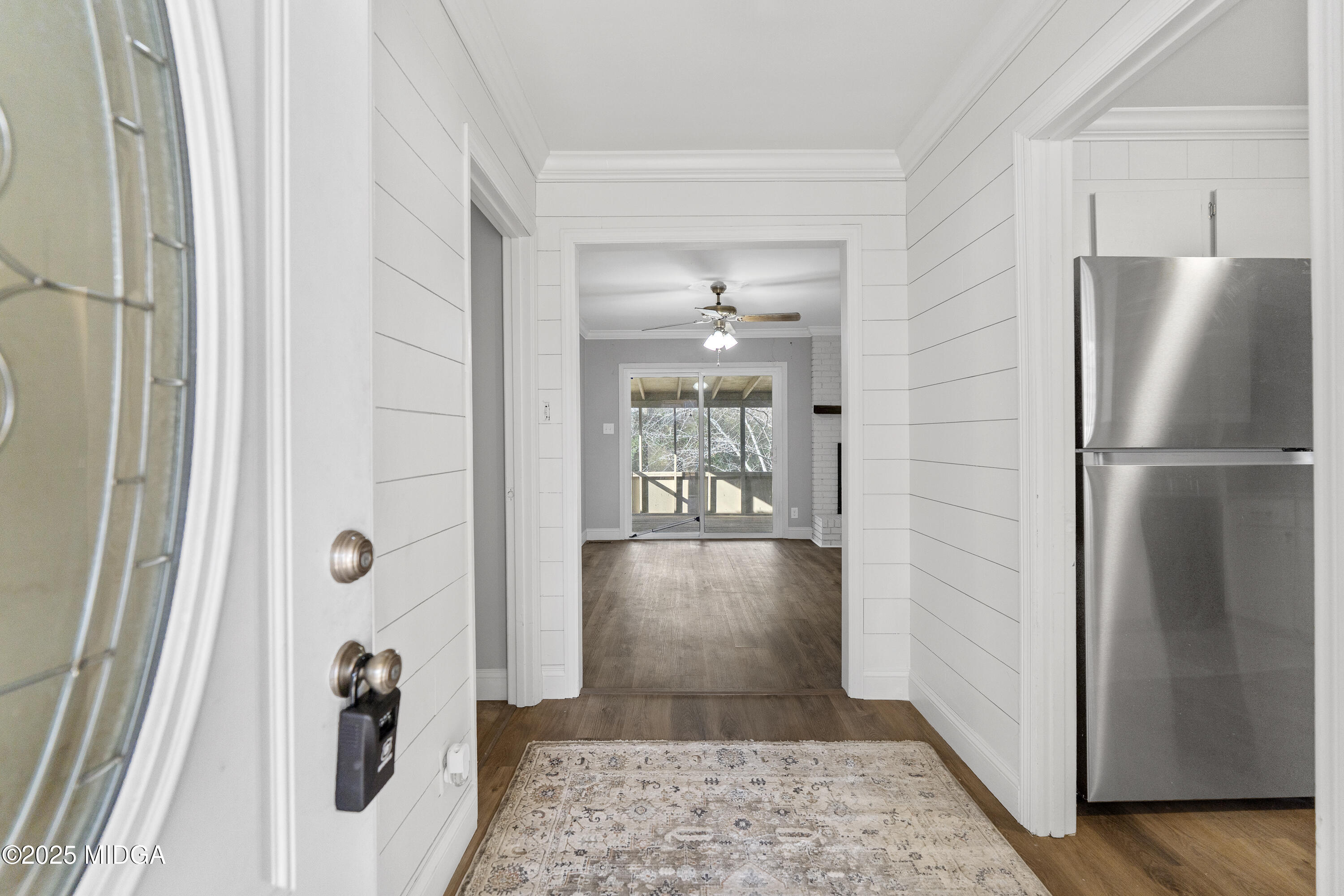 218 Matlock Lane Macon, GA 31210 - Photo 6 of 39 a view of a hallway with wooden floor and a livingroom view