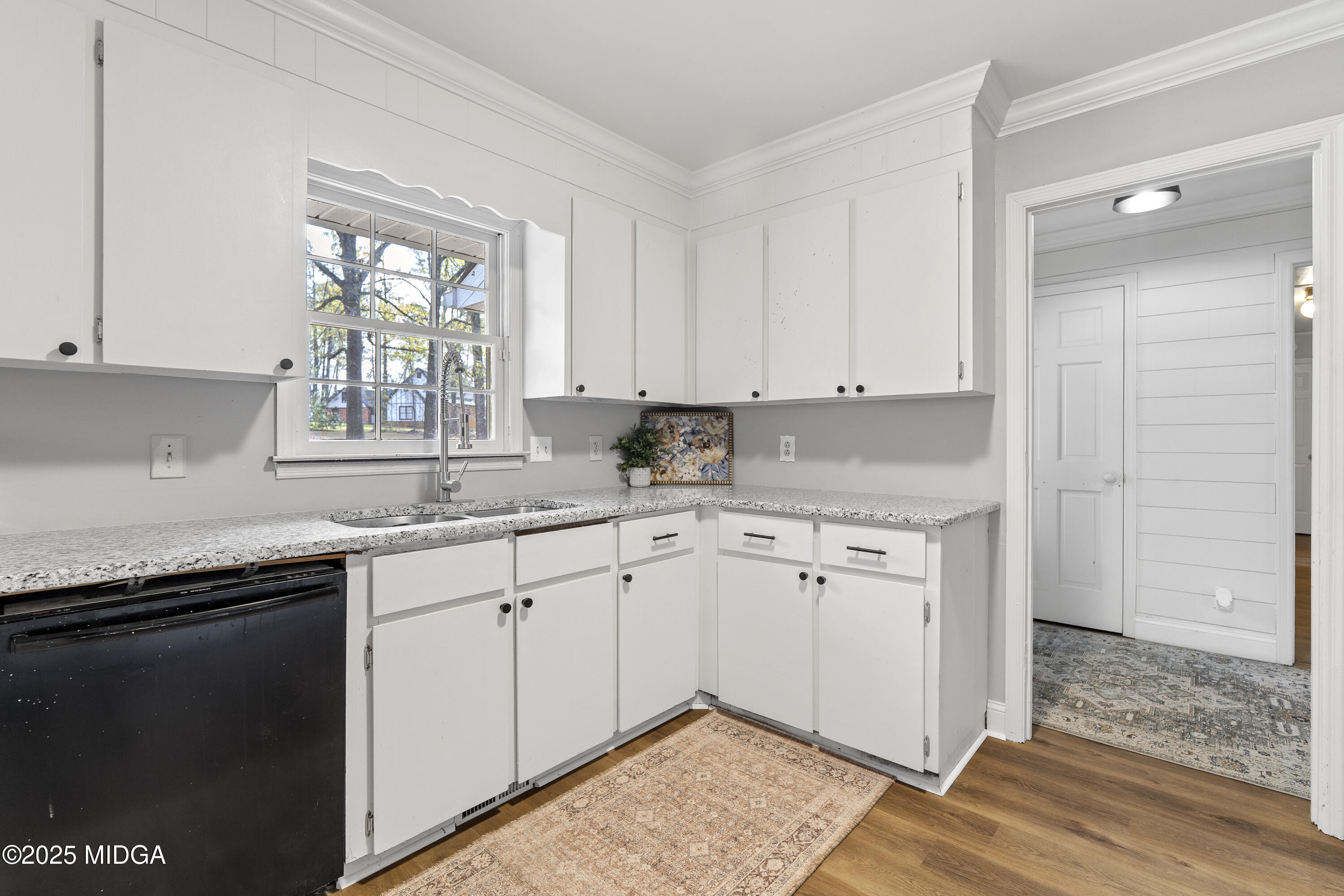 218 Matlock Lane Macon, GA 31210 - Photo 9 of 39 a kitchen with granite countertop cabinets sink and window