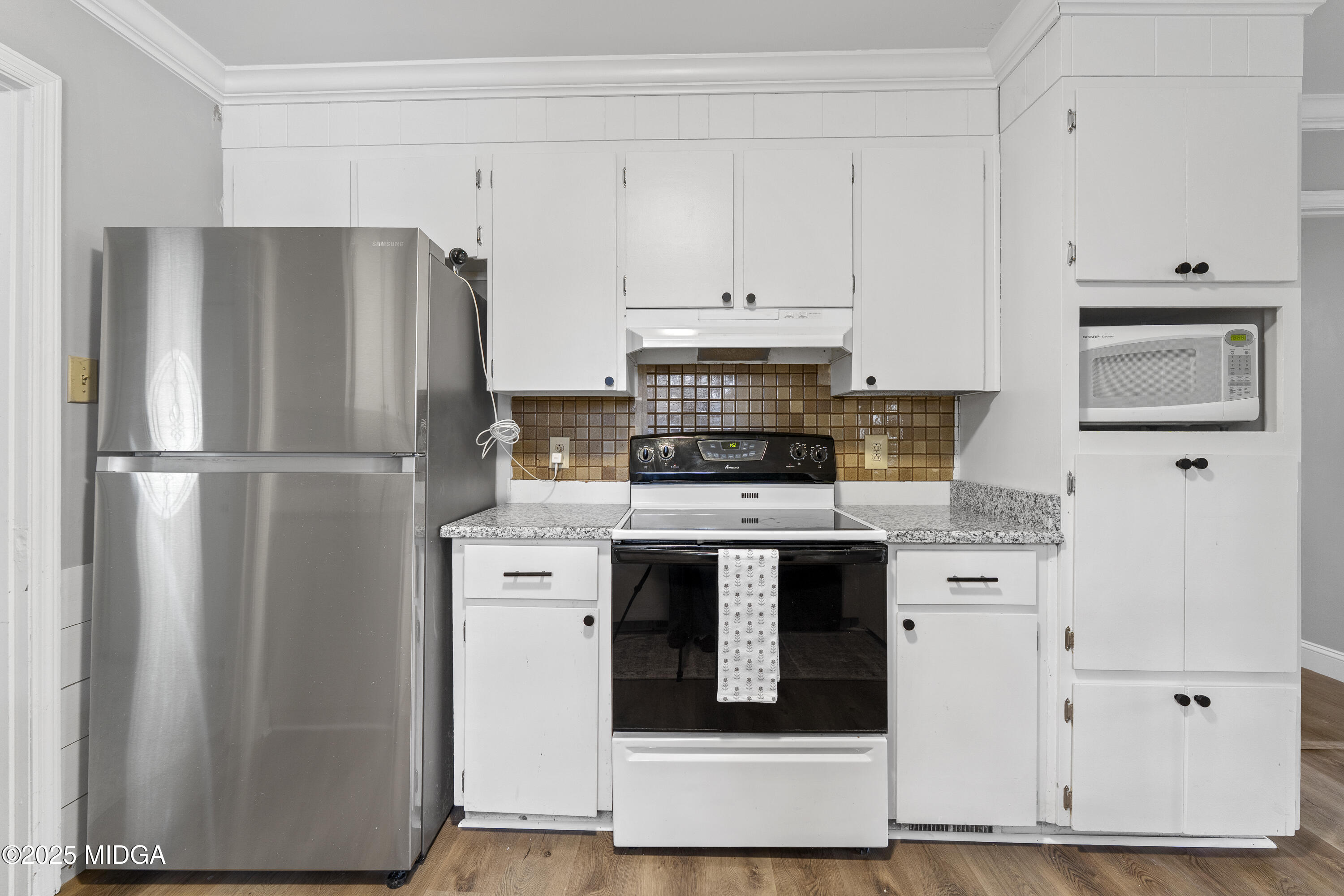 218 Matlock Lane Macon, GA 31210 - Photo 10 of 39 a kitchen with stainless steel appliances white cabinets and a refrigerator