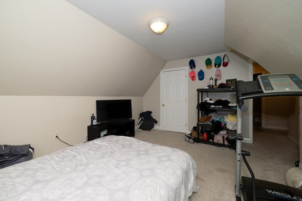 35 May Street Worcester, MA 01610 - Photo 4 of 30 a bedroom with a bed and a tv