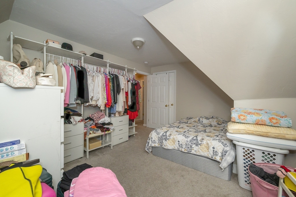 35 May Street Worcester, MA 01610 - Photo 6 of 30 a view of walk in closet with clothes and shoes
