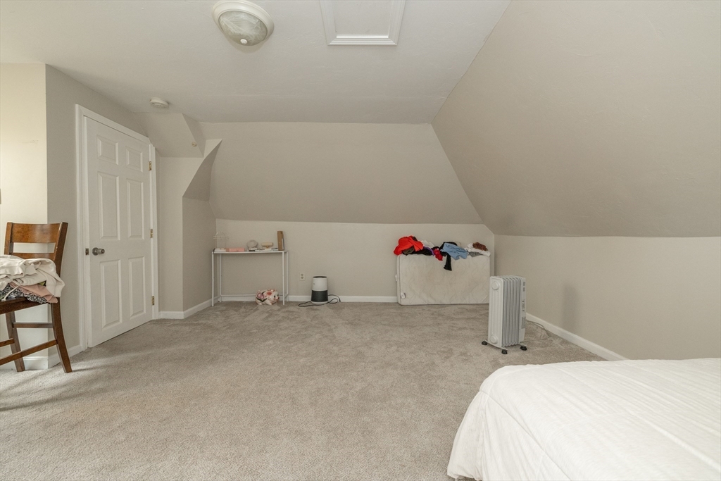 35 May Street Worcester, MA 01610 - Photo 10 of 30 a bedroom with a bed and a window