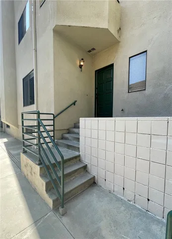 a view of staircase with white walls