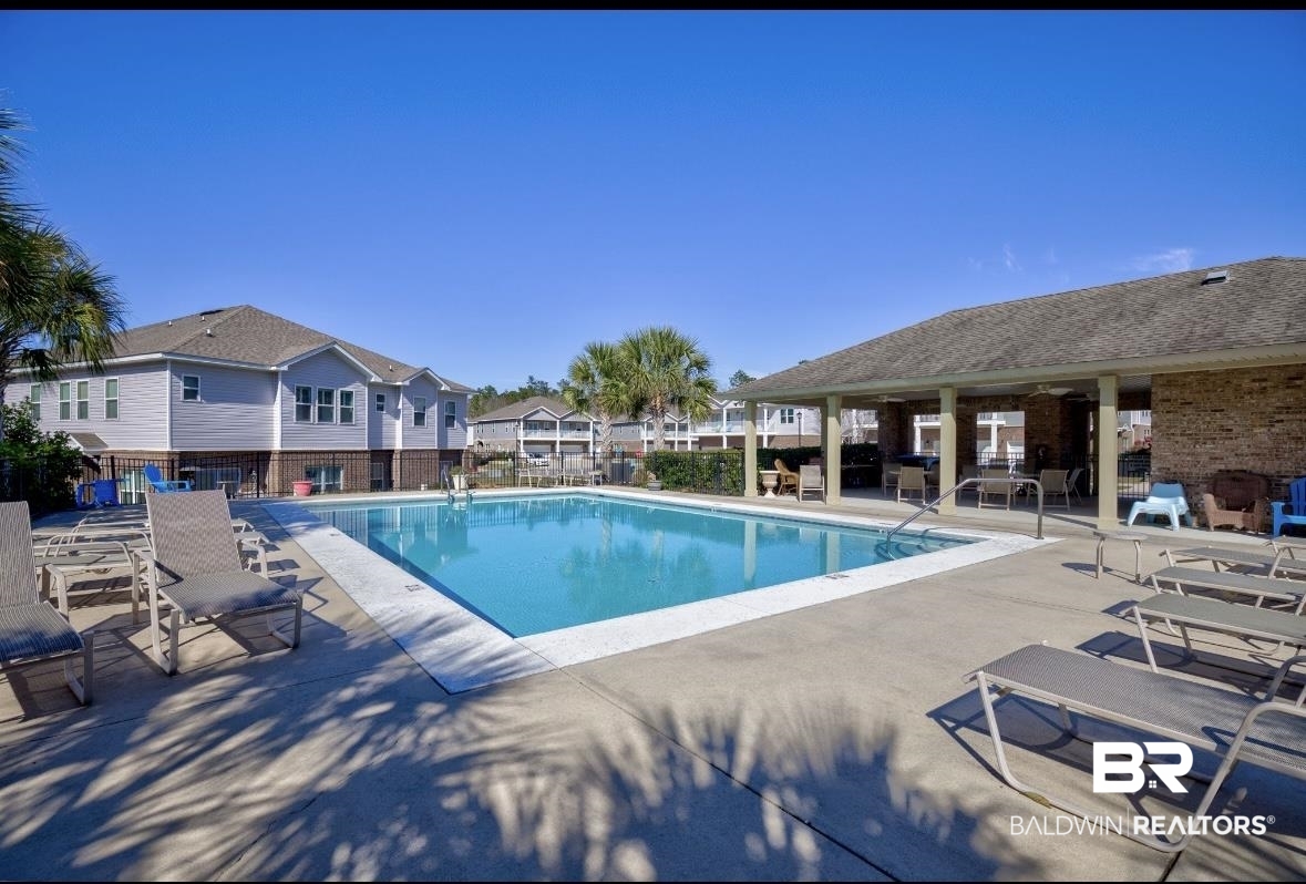 6867 Spaniel Drive, Unit B Daphne, AL 36527 - Photo 28 of 36 View of pool with a patio area