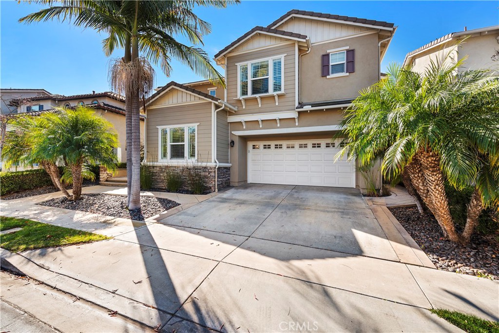 1412 Manera Ventosa San Clemente, CA 92673 - Photo 1 of 21 a front view of a house with a yard and garage
