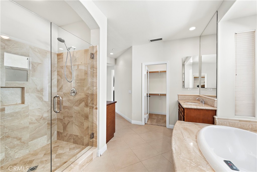 1412 Manera Ventosa San Clemente, CA 92673 - Photo 12 of 21 a bathroom with a tub shower and sink
