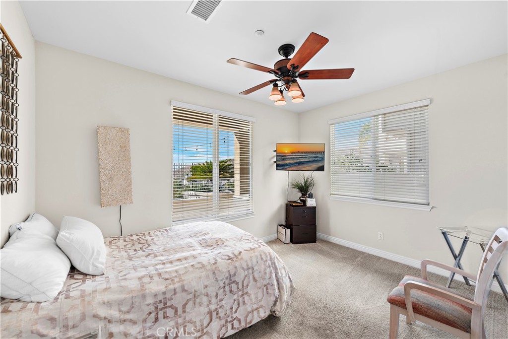 1412 Manera Ventosa San Clemente, CA 92673 - Photo 13 of 21 a bedroom with a bed and a couch