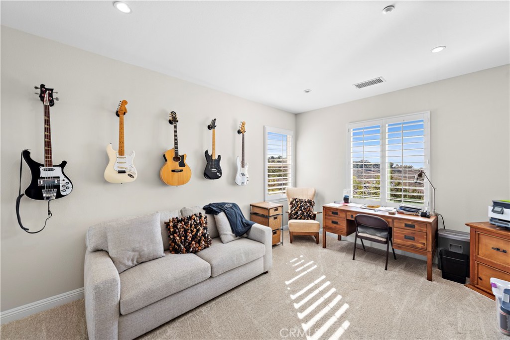 1412 Manera Ventosa San Clemente, CA 92673 - Photo 16 of 21 a living room with furniture and a window