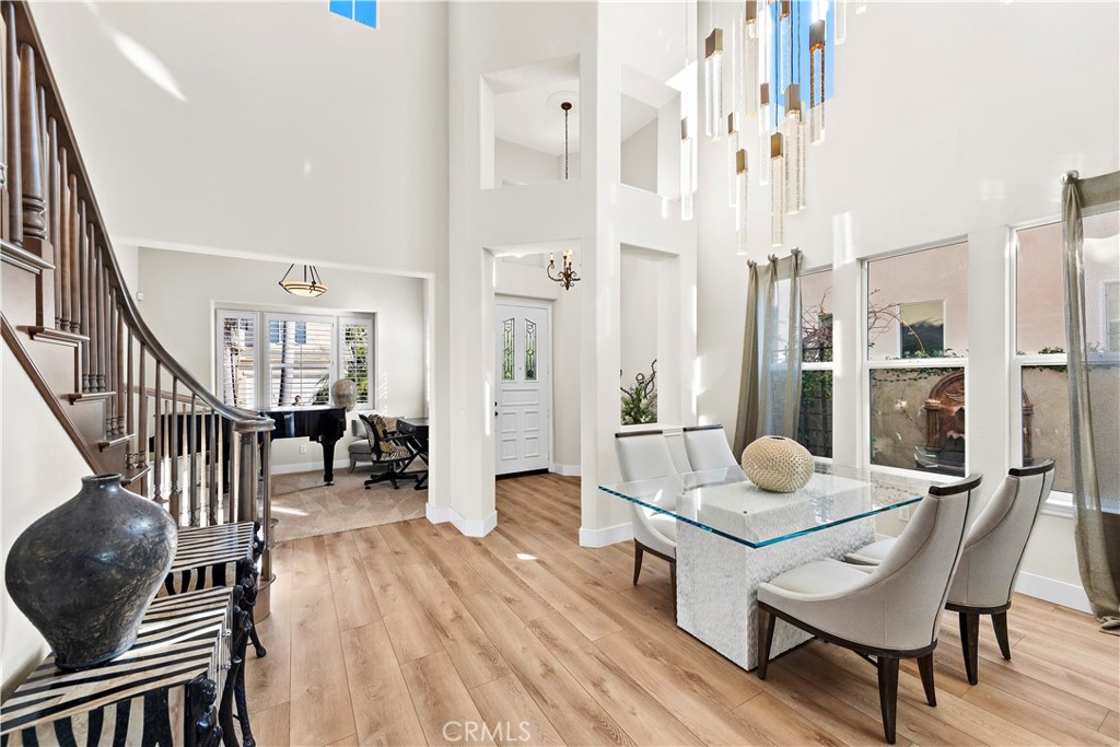 1412 Manera Ventosa San Clemente, CA 92673 - Photo 2 of 21 a dining room with furniture wooden floor and a chandelier