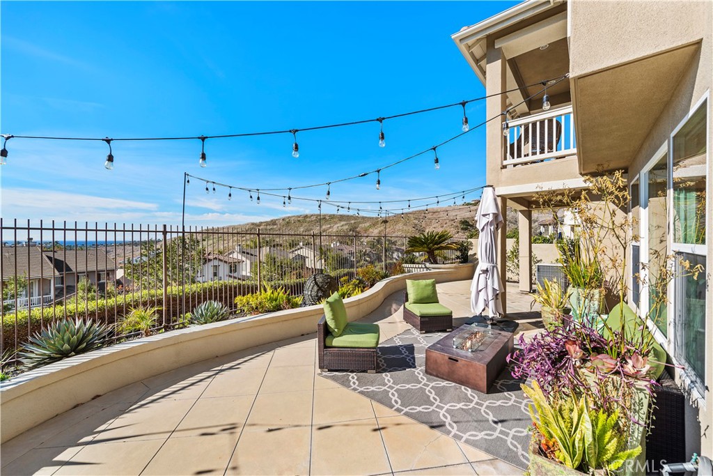 1412 Manera Ventosa San Clemente, CA 92673 - Photo 6 of 21 a view of a chairs and table in the balcony