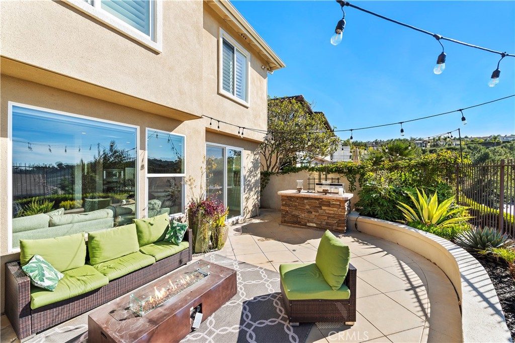 1412 Manera Ventosa San Clemente, CA 92673 - Photo 7 of 21 a view of a patio with couches table and chairs and potted plants