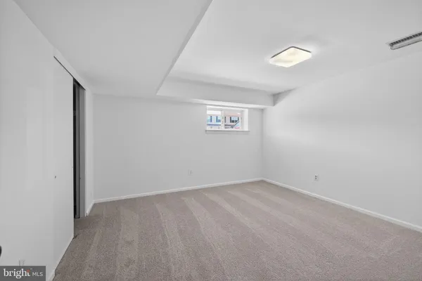 an empty room with a empty space and window