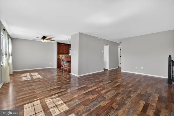 a view of a livingroom with wooden floor
