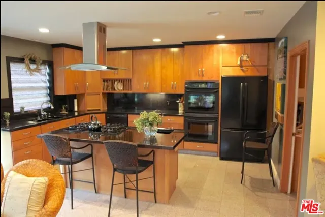 a dining room with furniture and a floor to ceiling window