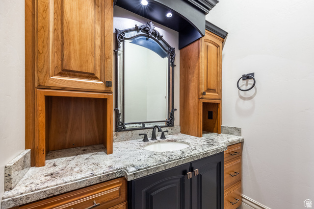 694 West Cephus Road Draper, UT 84020 - Photo 90 of 148 Vanity area featuring a granite countertop, undermount sink, and dark bronze fixtures