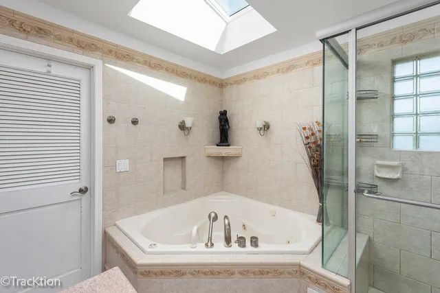 a bath tub sitting next to a white sink