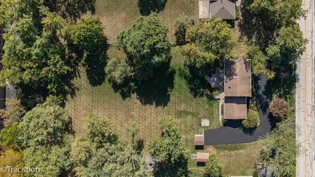 an aerial view of house with yard swimming pool and outdoor seating