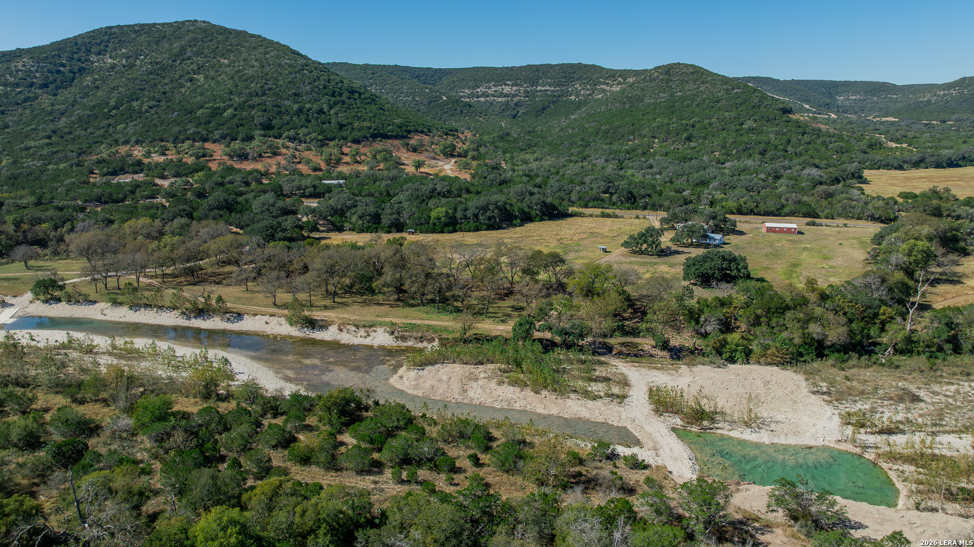 0 Rm 336 Leakey, TX 78873 - Photo 33 of 77 an aerial view of residential house with outdoor space and trees all around