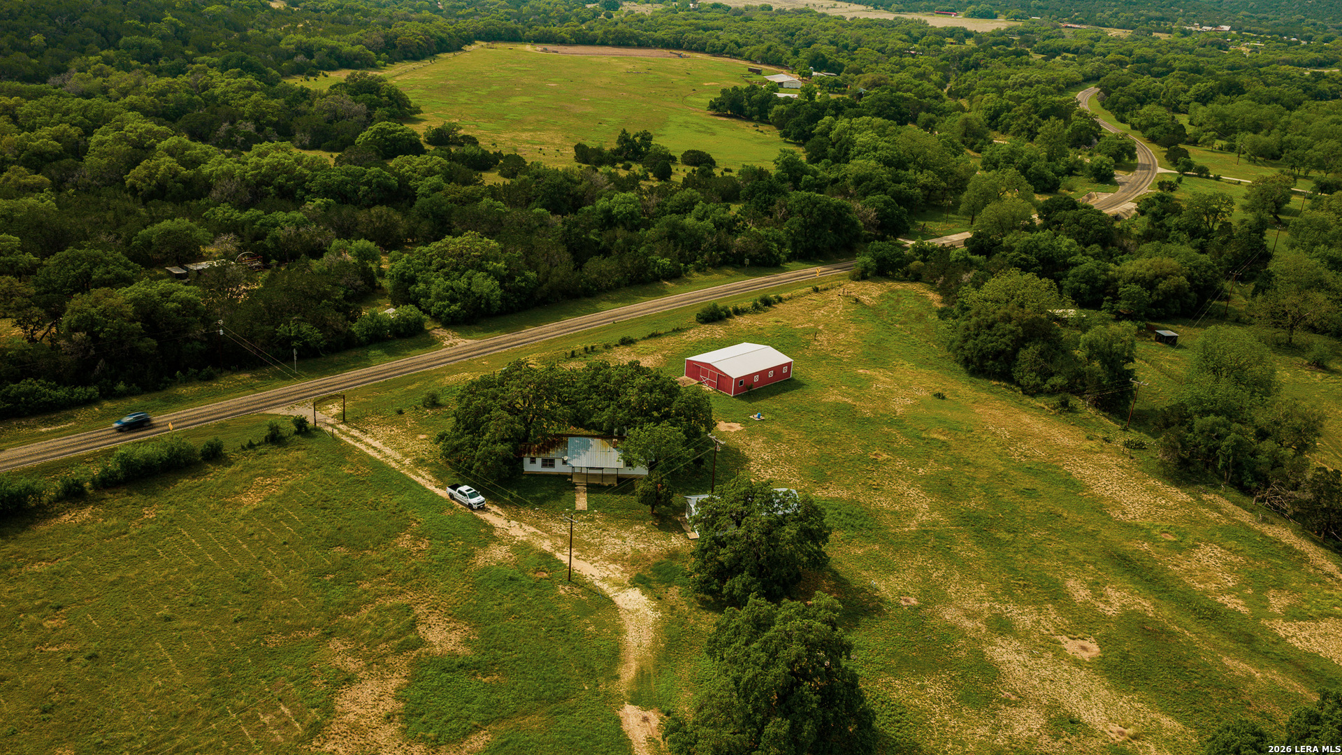 0 Rm 336 Leakey, TX 78873 - Photo 38 of 77 an aerial view of residential houses with outdoor space and swimming pool