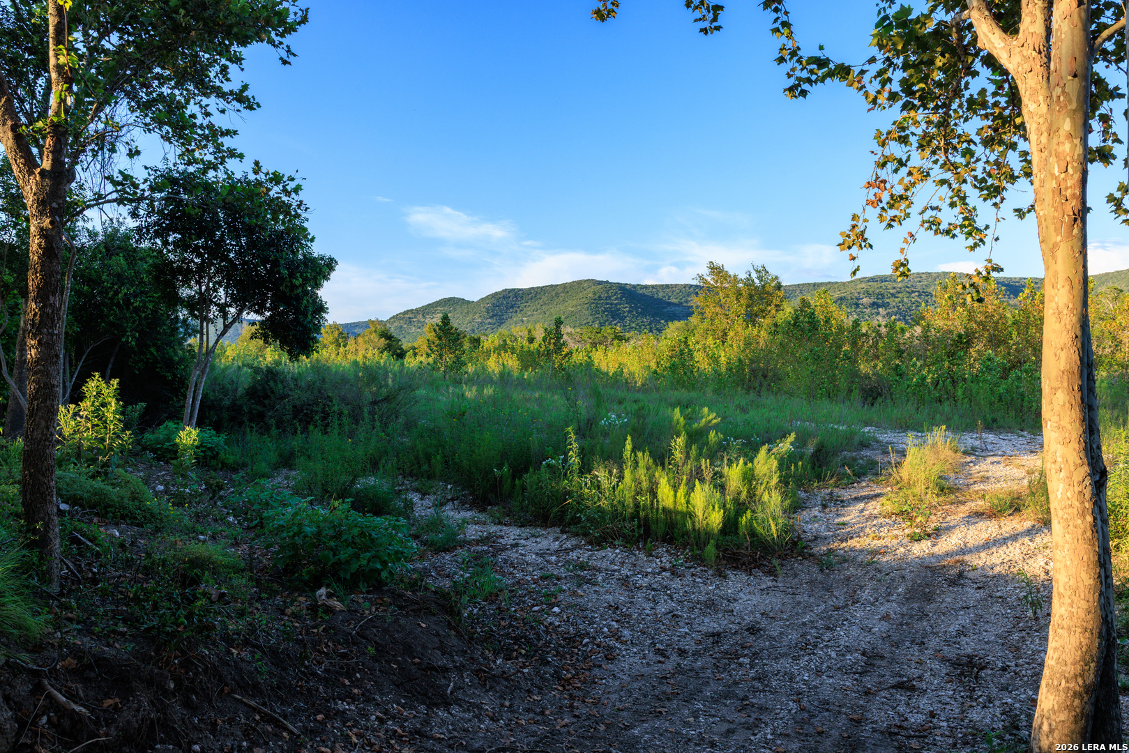 0 Rm 336 Leakey, TX 78873 - Photo 52 of 93 a view of a lake with a mountain in the background