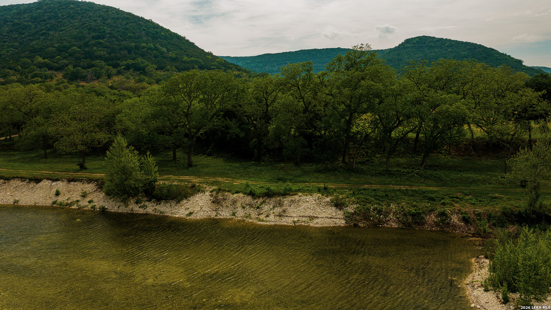 0 Rm 336 Leakey, TX 78873 - Photo 76 of 77 a view of a lake with a mountain in the background