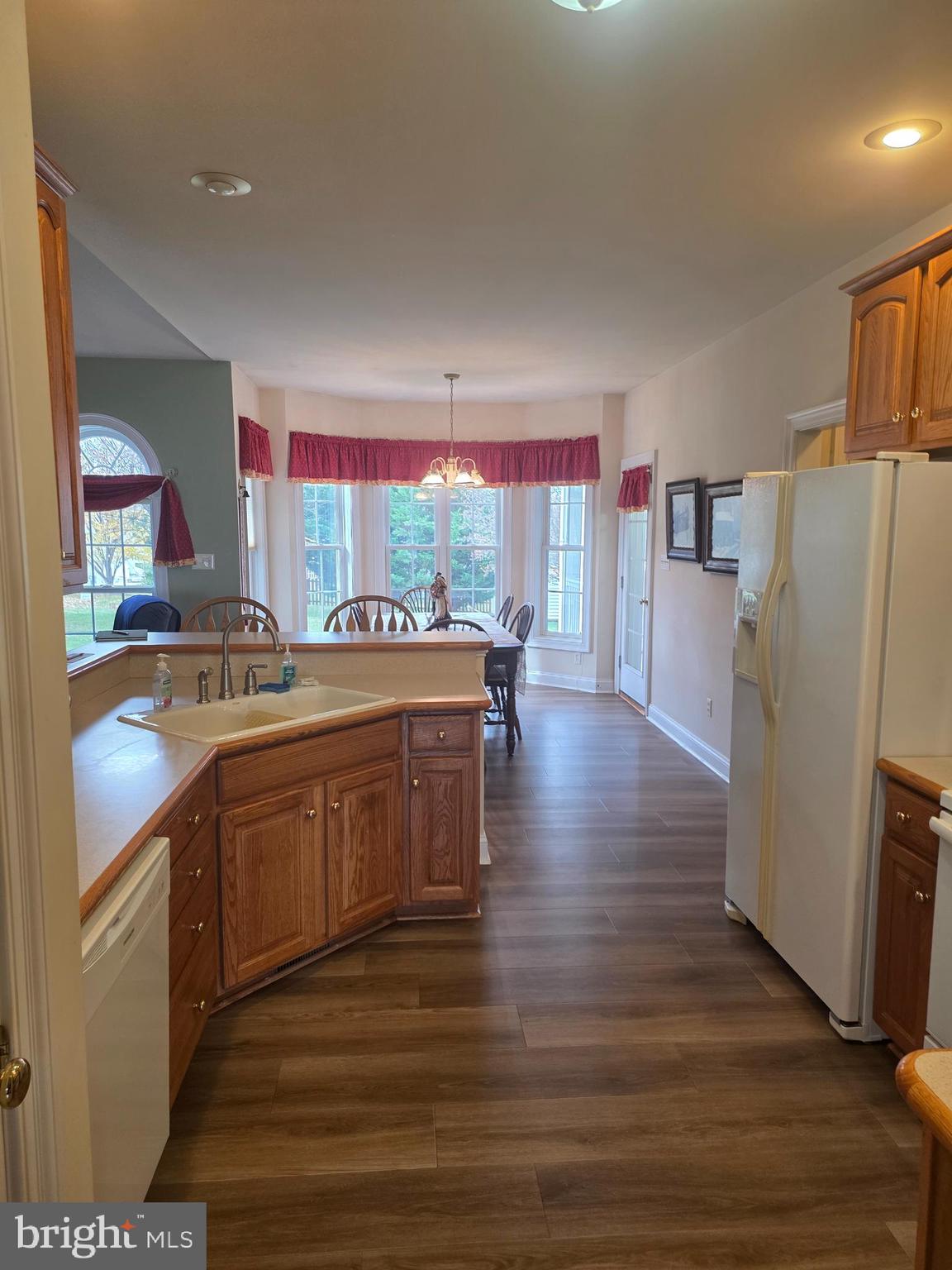 405 Custer Court Berryville, VA 22611 - Photo 11 of 34 a kitchen with stainless steel appliances granite countertop a refrigerator a sink dishwasher and a stove with wooden floor
