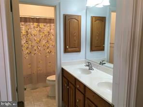 405 Custer Court Berryville, VA 22611 - Photo 14 of 34 a bathroom with a sink a toilet and shower