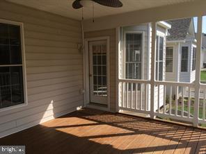 405 Custer Court Berryville, VA 22611 - Photo 16 of 34 a view of a house with a door and wooden floor
