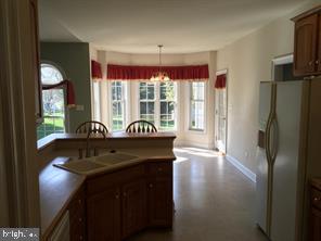 405 Custer Court Berryville, VA 22611 - Photo 17 of 34 a kitchen with windows and refrigerator