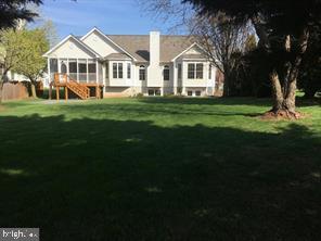 405 Custer Court Berryville, VA 22611 - Photo 2 of 34 a front view of a house with a garden