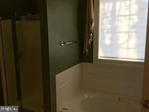 405 Custer Court Berryville, VA 22611 - Photo 26 of 34 a bathroom with a bathtub